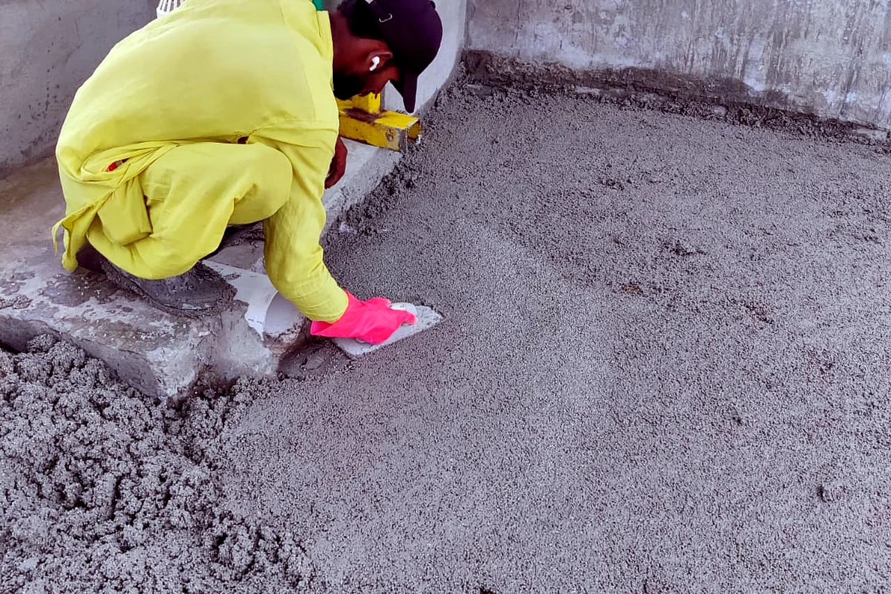 Roller-applied waterproof coating on a roof deck